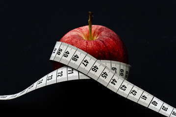 Red apple with measuring tape © bah69