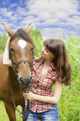 Brunette girl with horse