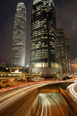 Fototapeta na wymiar Night view of Hong Kong with curving traffic light track.