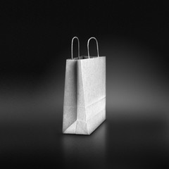 Sac papier sur fond luxueux noir, shopping ou achats de luxe