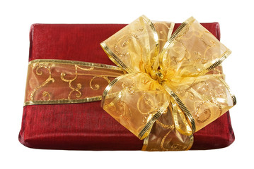 Red wrapped gift box with a big golden bow