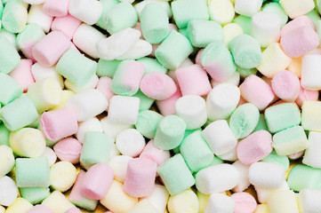 Various dry colourful sweets arranged as background