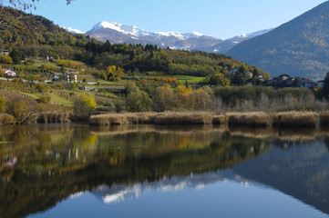 Autumn landscape with lake and mountains