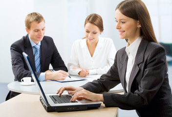 Fototapeta premium Three working businesspeople