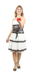 Beautiful girl in dress with gift, studio isolated