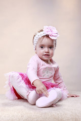 Cute baby girl in pink and magenta