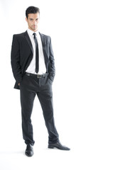 Business man puts the hands into the trouser pocket