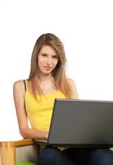Naklejka premium Young blond woman with computer