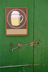 Beer draw poster in green wooden door