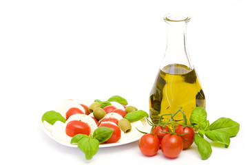 caprese - Italian salad with cherry tomatoes, olives and mozzare