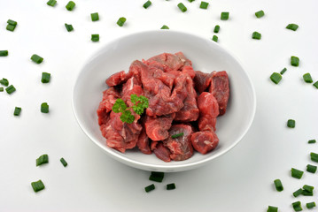fresh beef lean diced steak on a plate