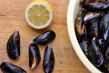 some fresh organic mussel and on a timber board