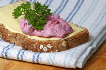 red organic herring salad on soda bread