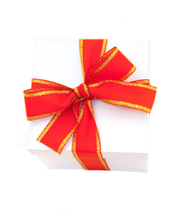 white gift box packed red bow
