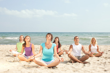 meditation group by the sea
