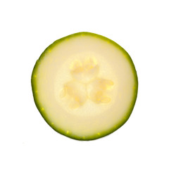 Slice of zucchini or courgette isolated on a white background