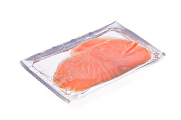 Smoked salmon slices in package isolated on white background