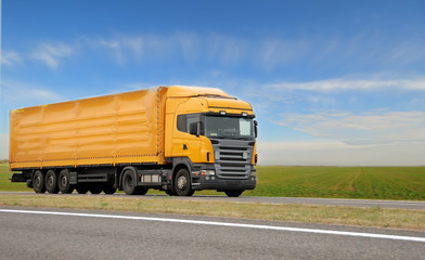 orange lorry with trailer