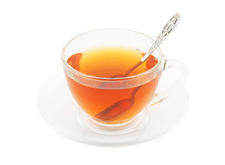 Transparent cup of tea with spoon  isolated on white