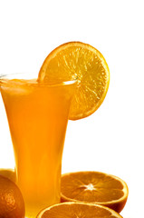 Glass of orange juice and oranges isolated on white