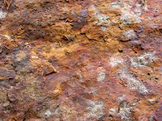 Background out of brown rock with moss on
