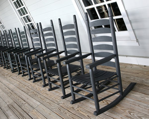 Rocking chairs lined up on the porch - 18780884