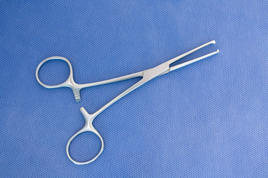 One Medical Clamp Isolated In Blue Background