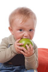 little boy and green apple.