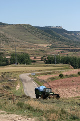 Old woodcutting tractor in mountains