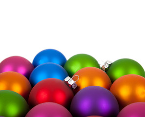 Multi-colored christmas ornament/baubles with copy space