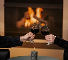 Hands holding glas of wine