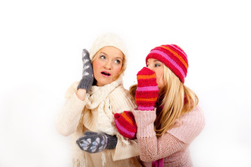 Two young winter woman friends in gloves