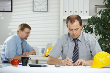 Architect planning at desk