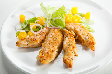 Grilled turkey fillet, and vegetable salad