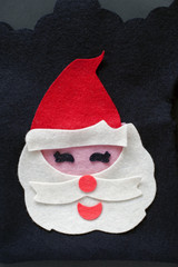 Fabric Santa claus figurine isolated on black background