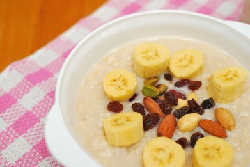 Healthy cereal topped with fruit and nuts