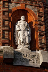 religious statue and ornate brickwork