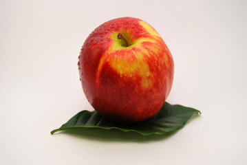 Red apple and green leaf
