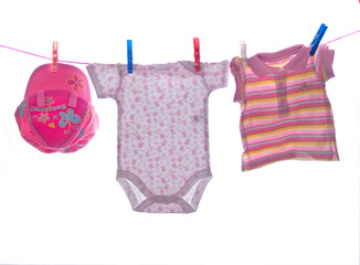 Baby clothes hang on clothesline