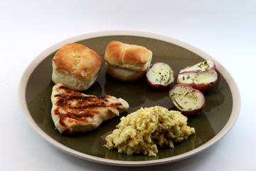 Dinner plate with grilled chicken and other fixin's