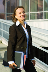 Happy businesswoman at the airport.