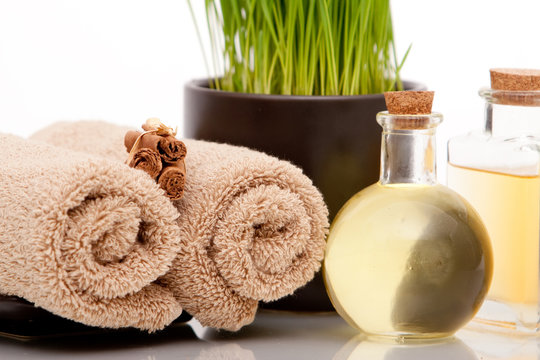 Spa decor with towels and oils
