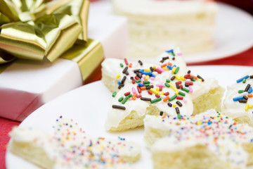 Obraz na płótnie Canvas Frosted cake pieces with sprinkles
