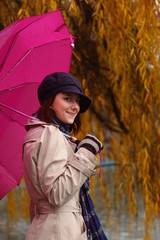 Beautiful young girl under umbrella