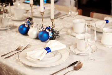 Elegant blue and white Christmas table setting
