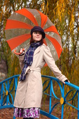 Beautiful young girl under umbrella