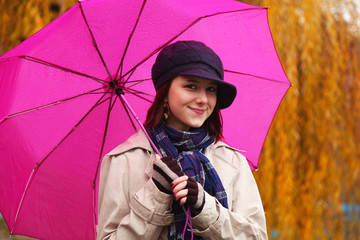 Beautiful young girl under umbrella