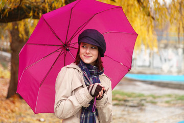 Beautiful young girl under umbrella