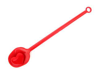 Red plastic ladle for cooking from heart