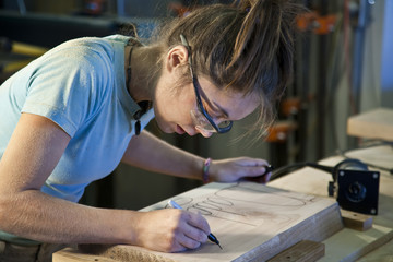 Young woman cabinet making.